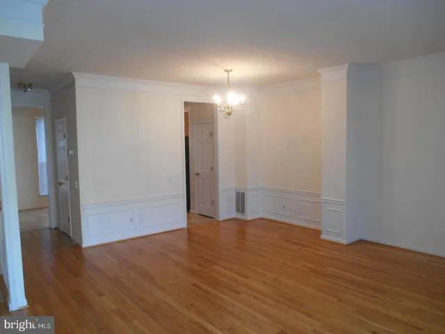 a kitchen with a sink cabinets and a window