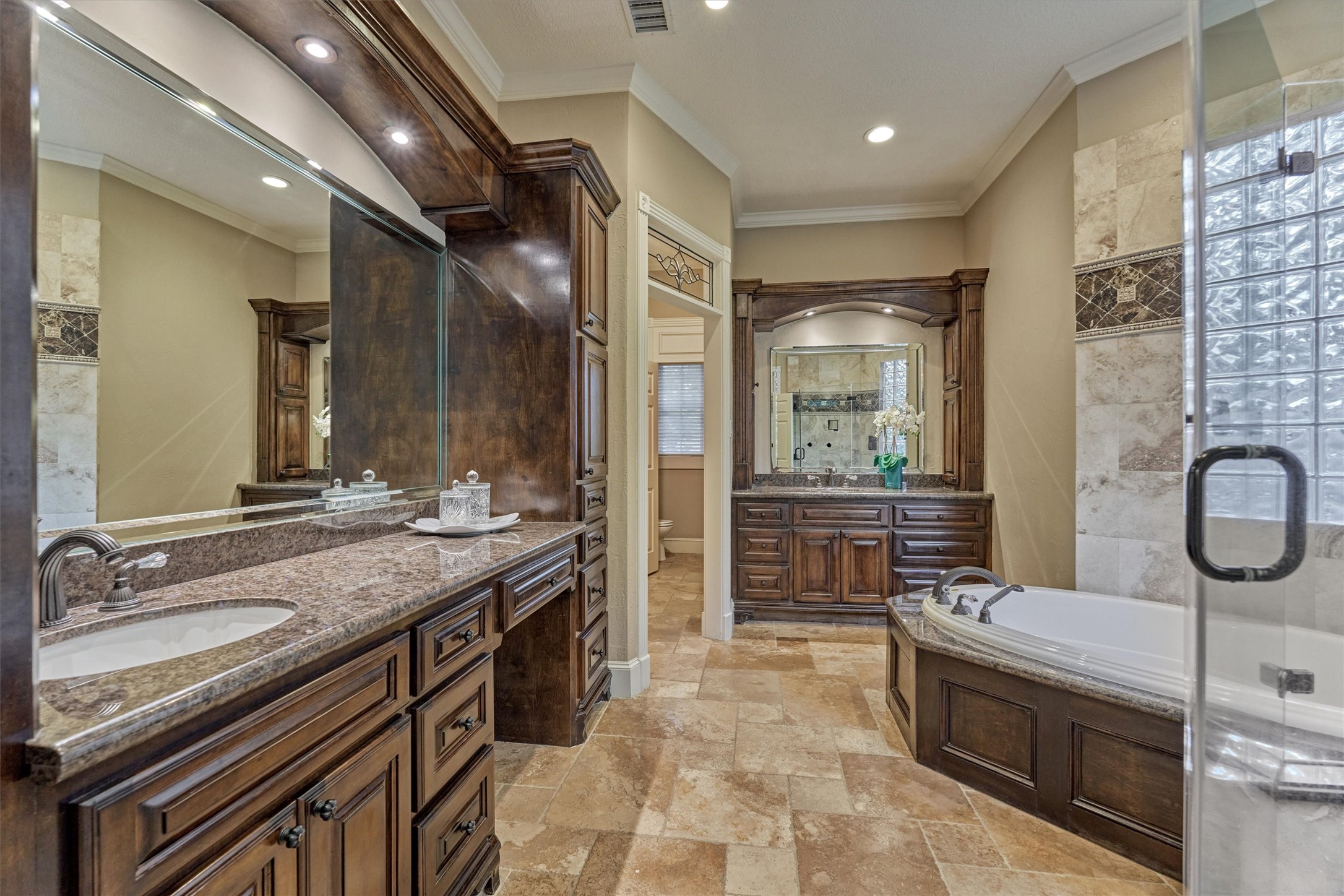 18 Treevine Court The Woodlands, TX 77381 - Photo 23 of 50 Luxurious, spa-like primary bathroom features every amenity you could need, along with dual walk-in closets.