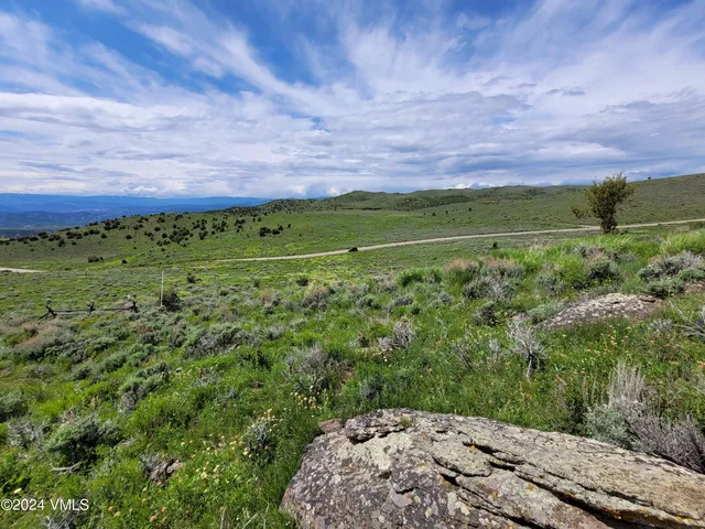 a view of a field with an outdoor space