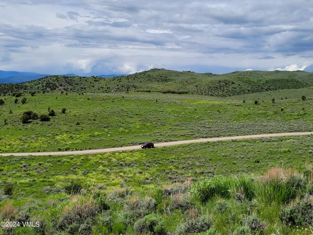 a view of a green field with lots of green space