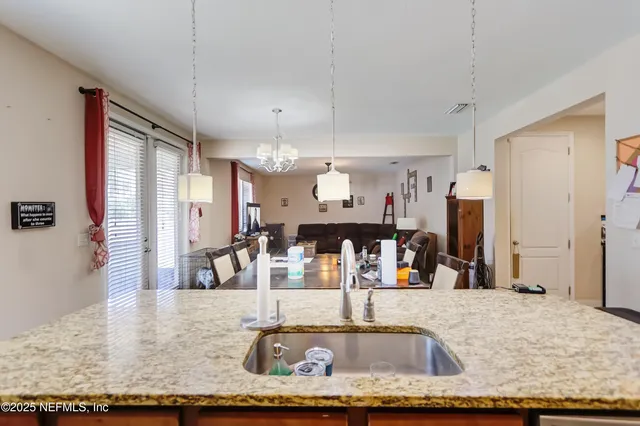 a view of a living room and kitchen