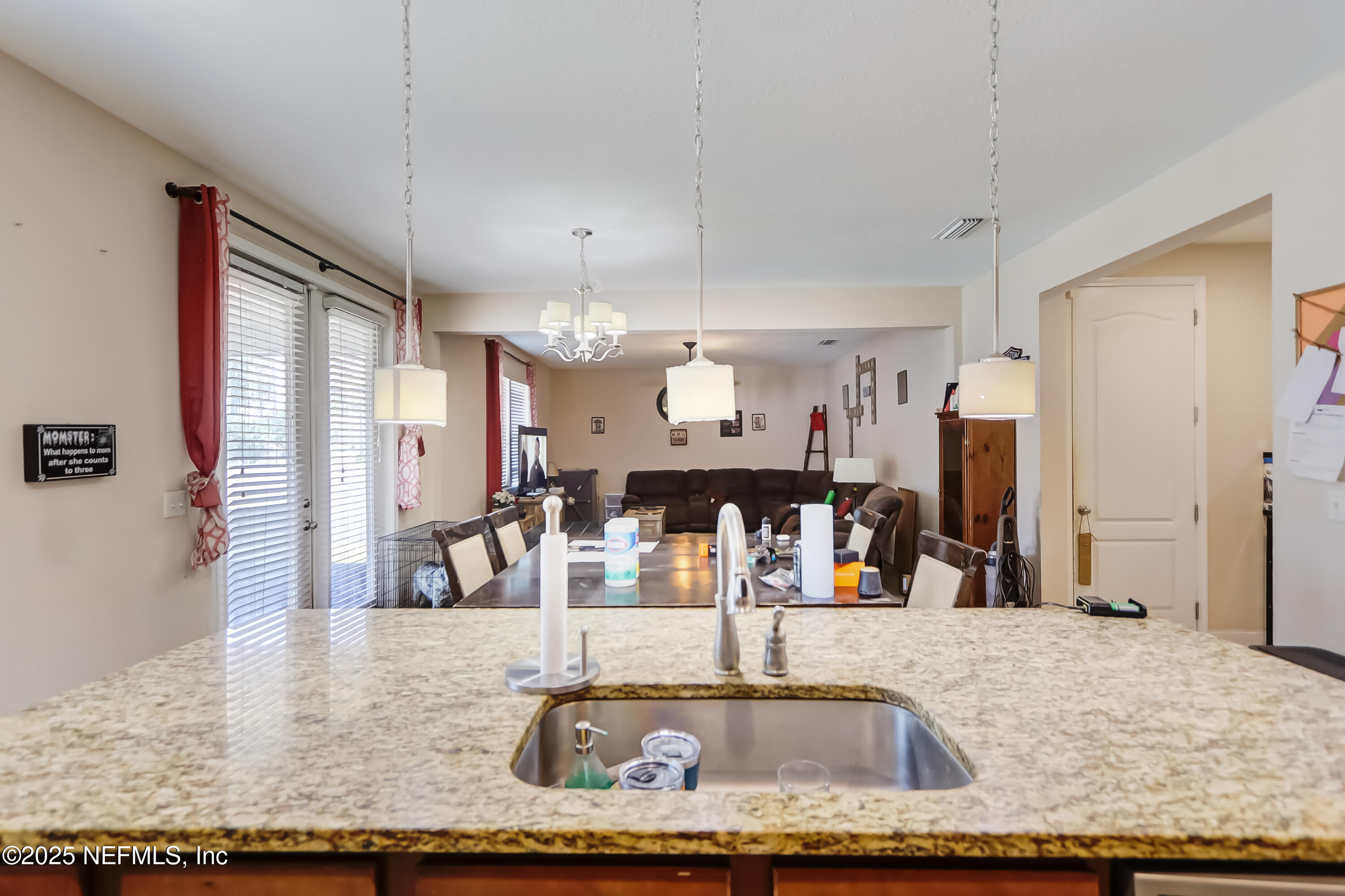 1071 Wetland Ridge Circle Middleburg, FL 32068 - Photo 18 of 41 a view of a living room and kitchen
