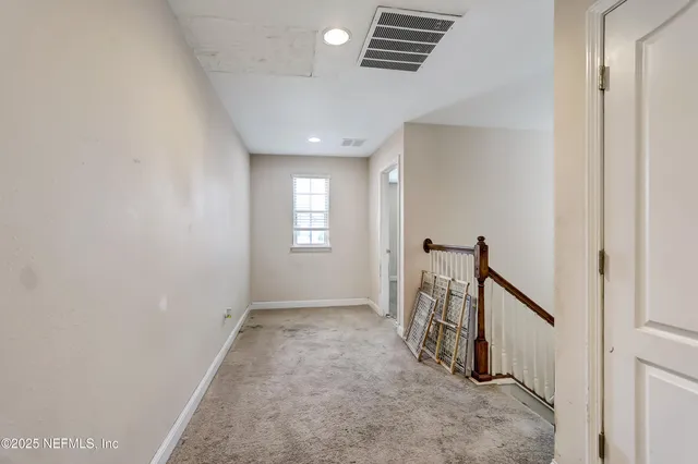 a view of hallway with stairs