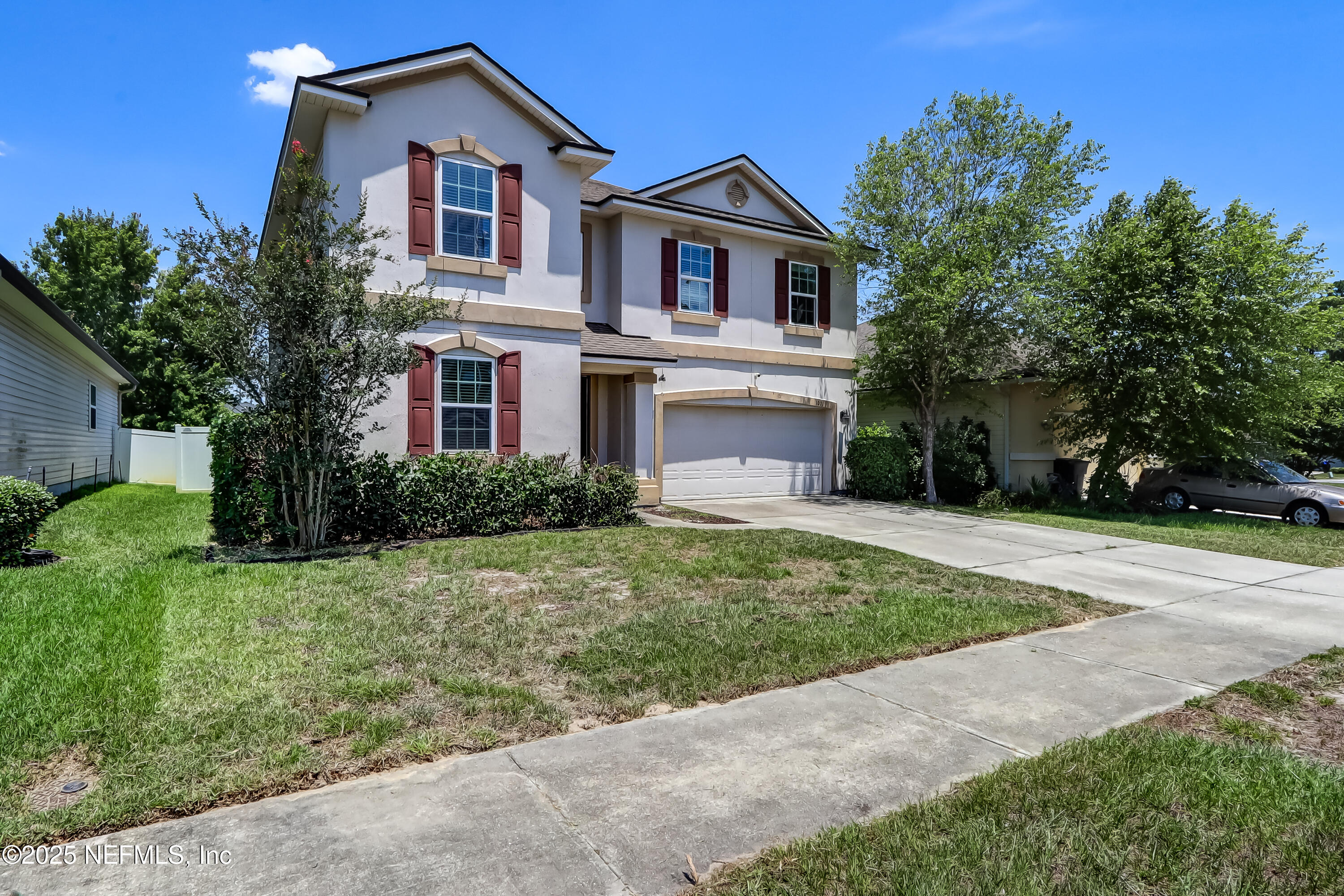 1071 Wetland Ridge Circle Middleburg, FL 32068 - Photo 2 of 41 a front view of a house with a yard