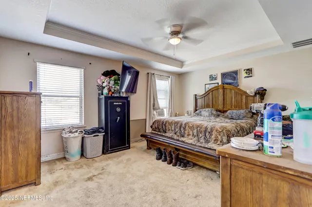 a bedroom with a bed and furniture