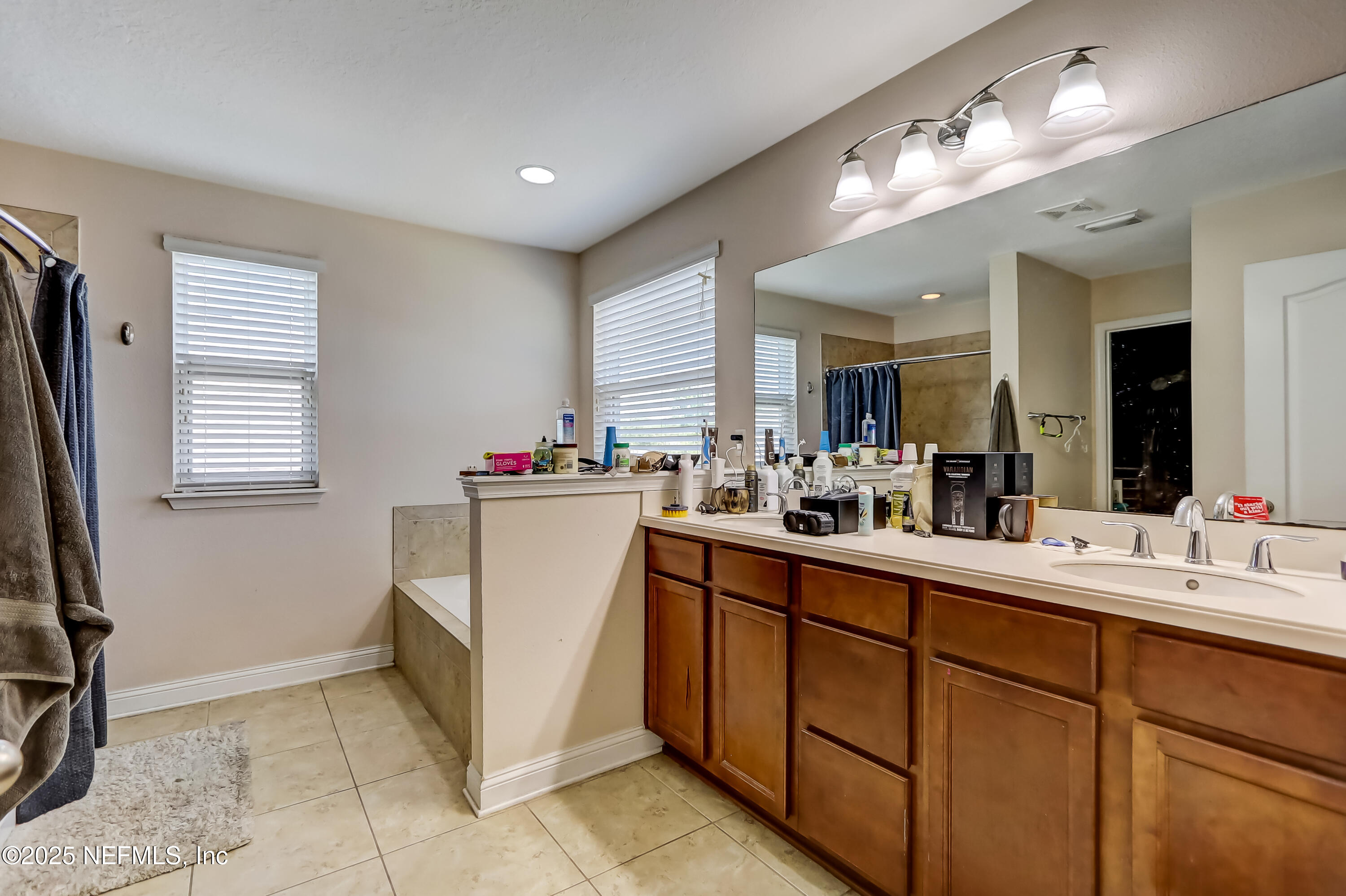 1071 Wetland Ridge Circle Middleburg, FL 32068 - Photo 24 of 41 a room with cabinets a sink a window and stainless steel appliances