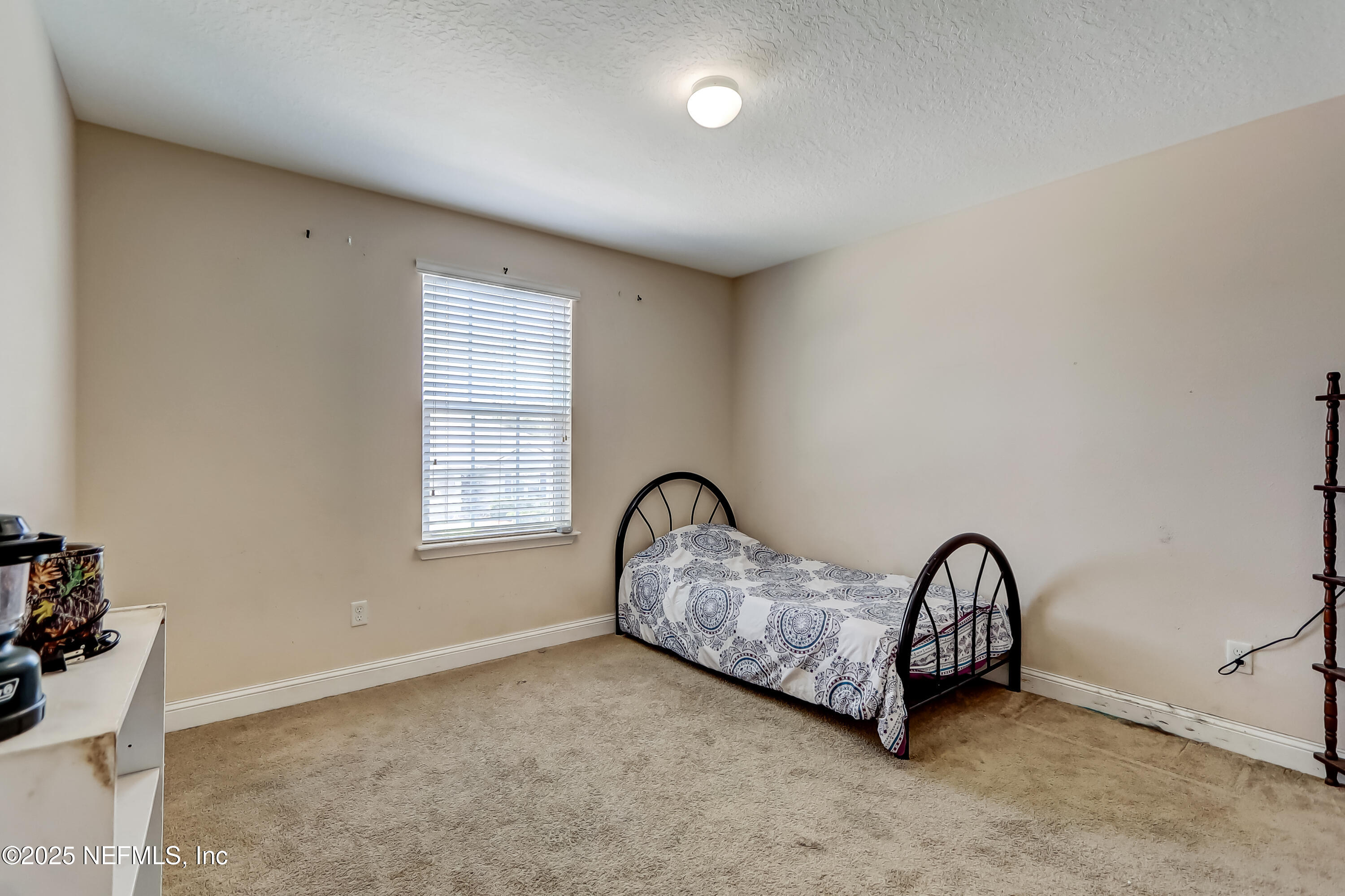 1071 Wetland Ridge Circle Middleburg, FL 32068 - Photo 29 of 41 a room with a table and a chair