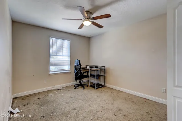 a view of a porch with furniture and a yard