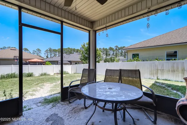 a large house with a big yard and large trees