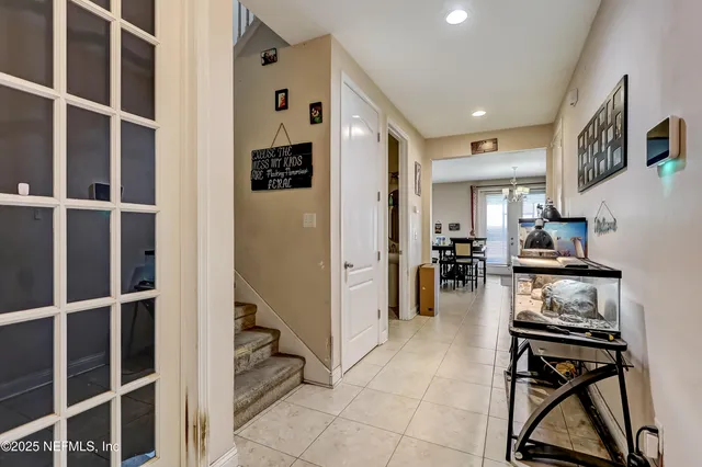 a kitchen with stainless steel appliances kitchen island granite countertop a refrigerator and a stove top oven