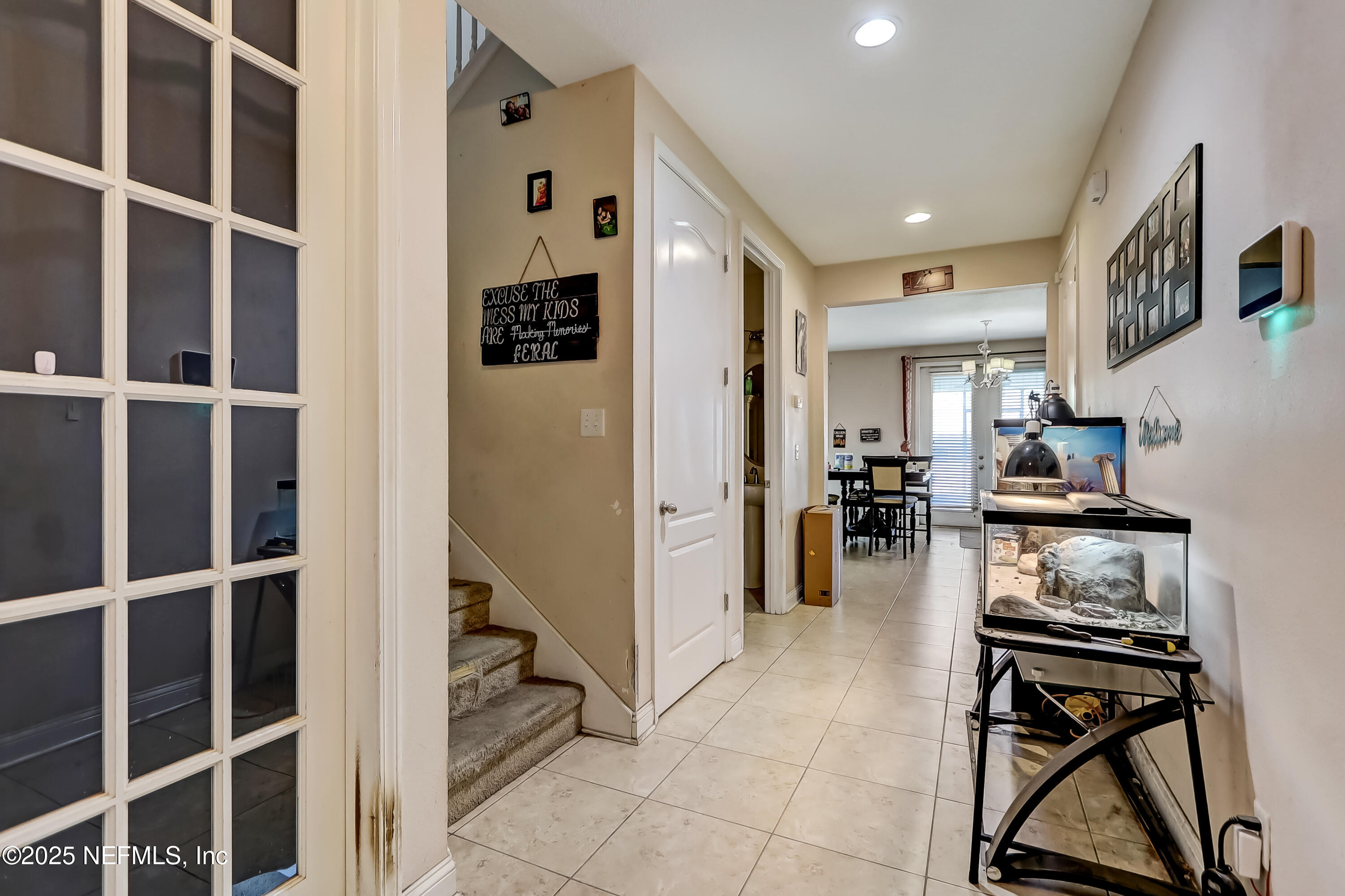 1071 Wetland Ridge Circle Middleburg, FL 32068 - Photo 6 of 41 a kitchen with stainless steel appliances kitchen island granite countertop a refrigerator and a stove top oven