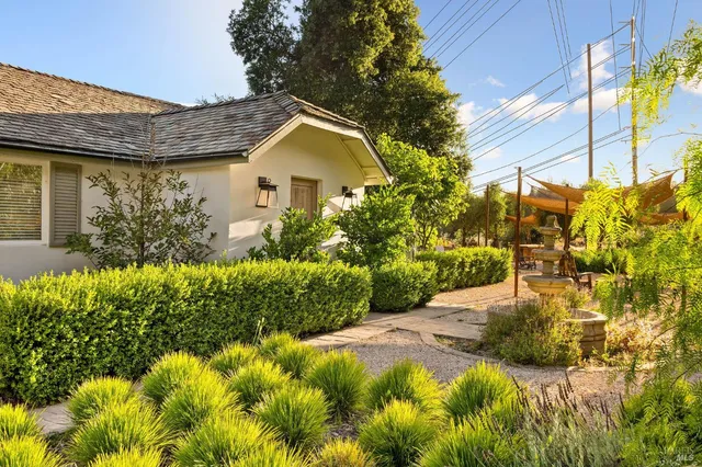 a view of a house with a garden
