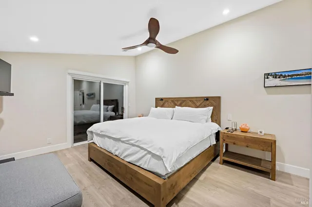 a bedroom with bed and window