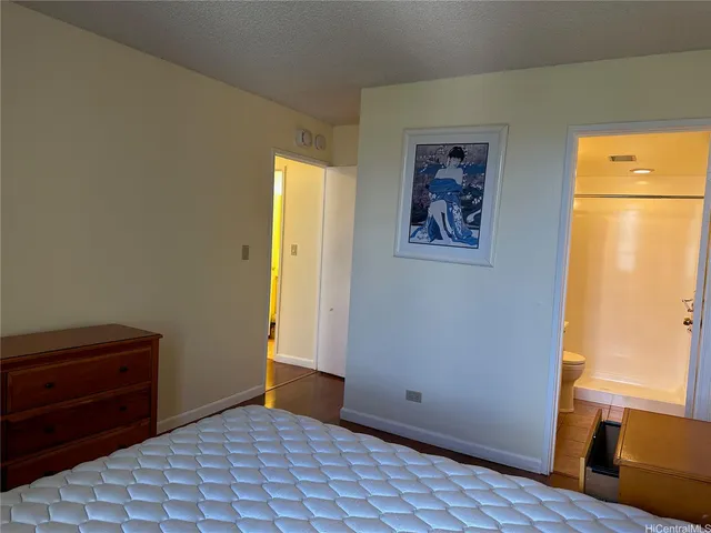 a view of room with window and wooden floor