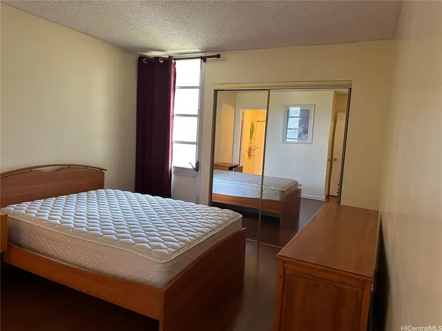 a bedroom with a bed and a table in it