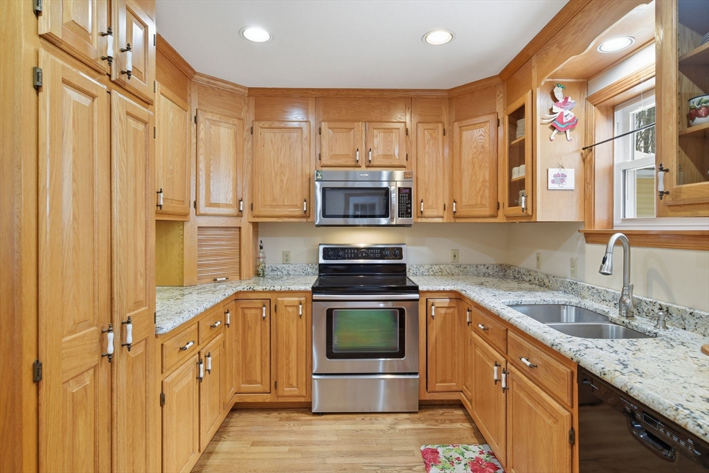 9 East Hill Road Monson, MA 01057 - Photo 18 of 41 a kitchen with stainless steel appliances granite countertop a stove sink and cabinets