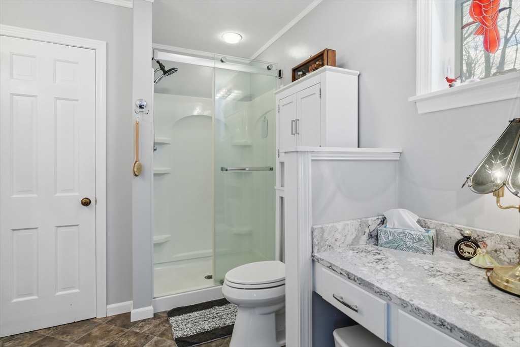 9 East Hill Road Monson, MA 01057 - Photo 25 of 41 a bathroom with a granite countertop sink toilet and shower