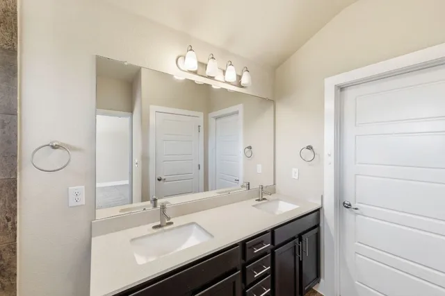 an empty room with window and ceiling fan