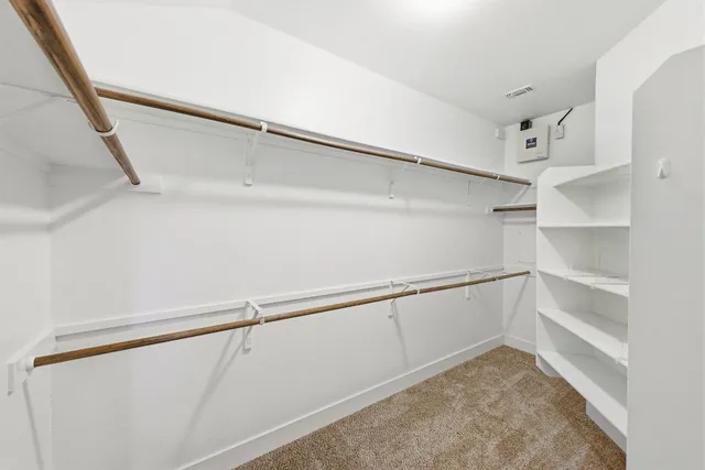 a bathroom with a shower and a sink