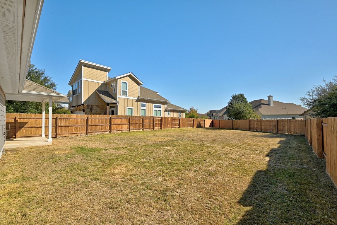 7013 Brick Slope Path Austin, TX 78744 - Photo 27 of 28 View of fenced backyard