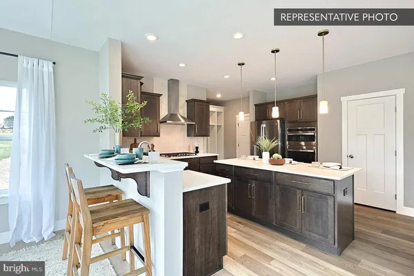 a kitchen with a sink and a window