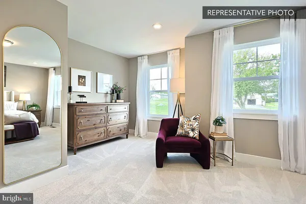 a white bath tub sitting in a bathroom next to a window