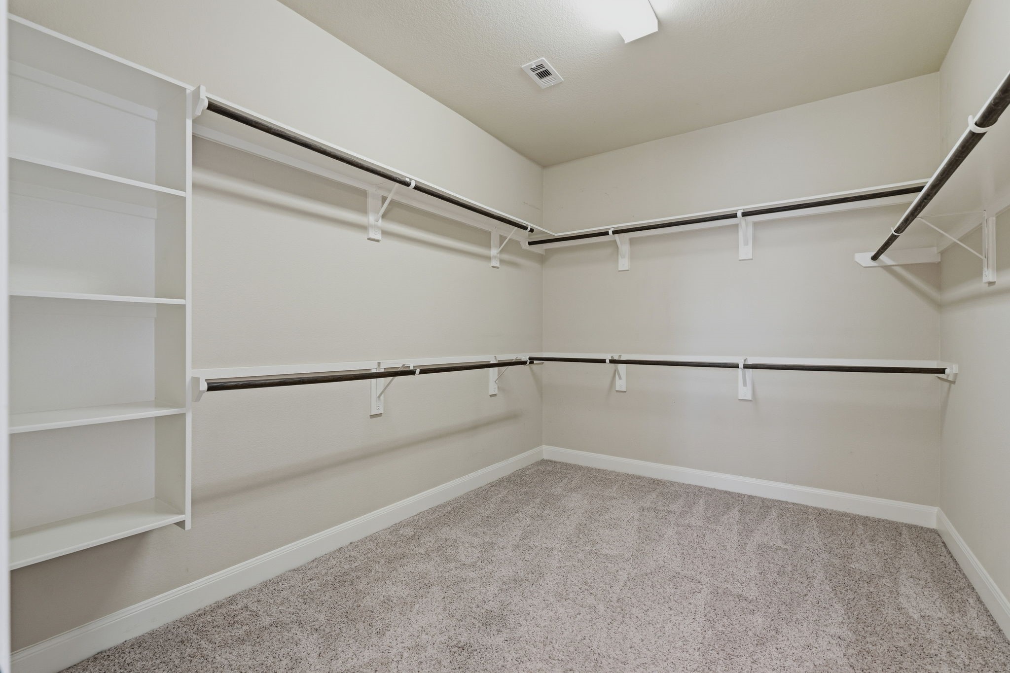 31407 Falling Cedar Court Spring, TX 77386 - Photo 17 of 47 Let's go shopping! There is space for everything we might find in this primary closet!