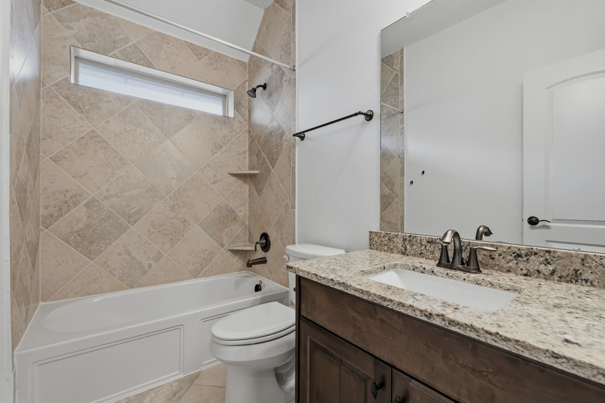 31407 Falling Cedar Court Spring, TX 77386 - Photo 25 of 47 This is the bath for the previous 2 bedrooms. Love the window that allows light in...