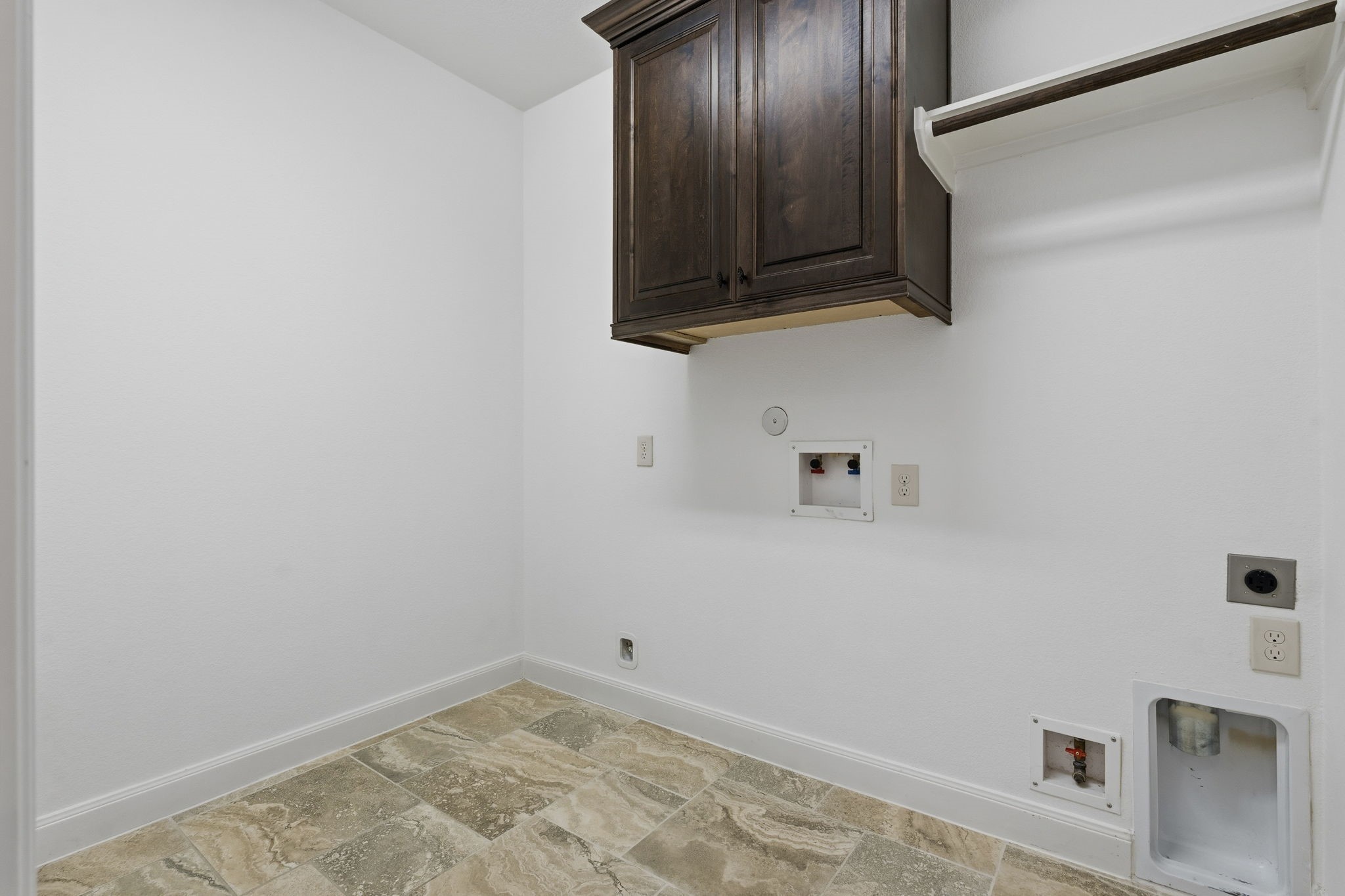31407 Falling Cedar Court Spring, TX 77386 - Photo 28 of 47 The laundry room also has space for a fridge, storage and hanging space.