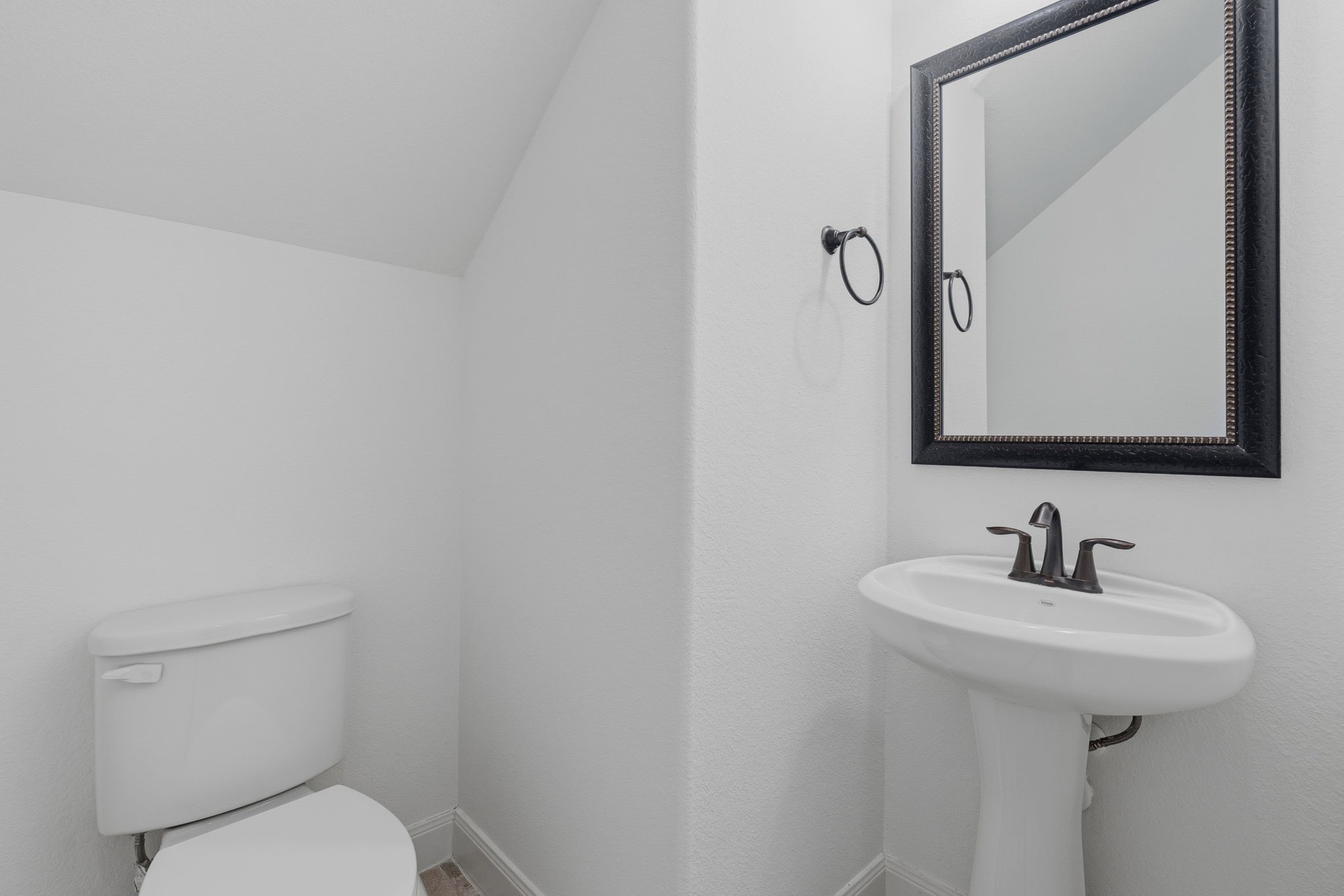 31407 Falling Cedar Court Spring, TX 77386 - Photo 29 of 47 The half bath downstairs for your guests.