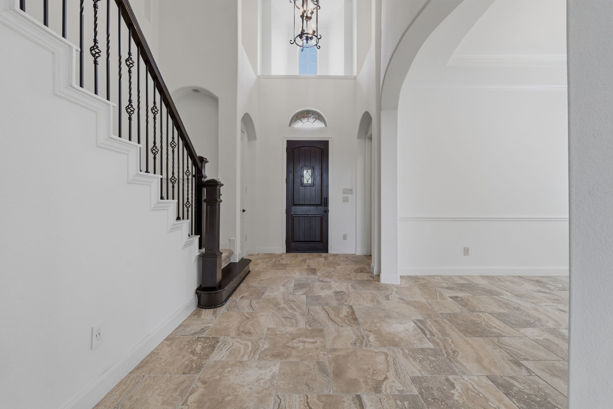 31407 Falling Cedar Court Spring, TX 77386 - Photo 3 of 47 Light color walls add more volume to this foyer with 19 foot ceilings!
