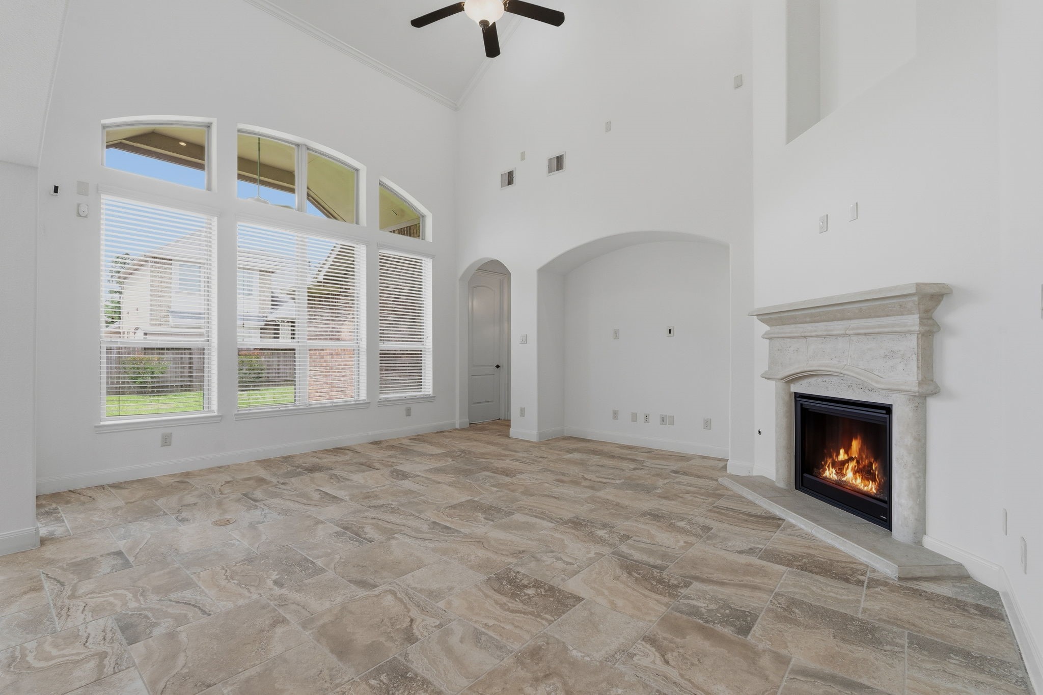 31407 Falling Cedar Court Spring, TX 77386 - Photo 4 of 47 This family room offers views of the backyard through these windows that also let the natural light flow into the room. With a corner fireplace there is room for just about any size TV!