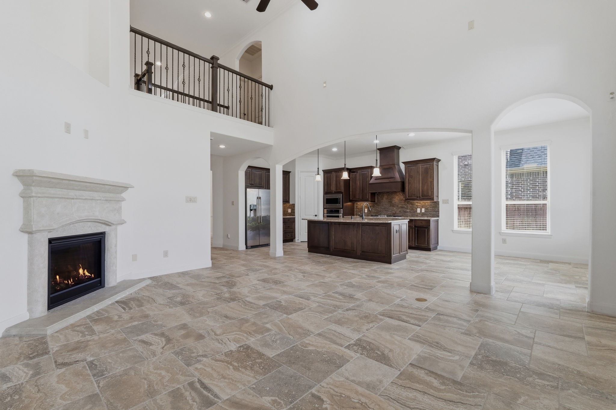 31407 Falling Cedar Court Spring, TX 77386 - Photo 5 of 47 The kitchen is open to the family room allowing family and friends to mingle! This room offers 19 foot ceilings!