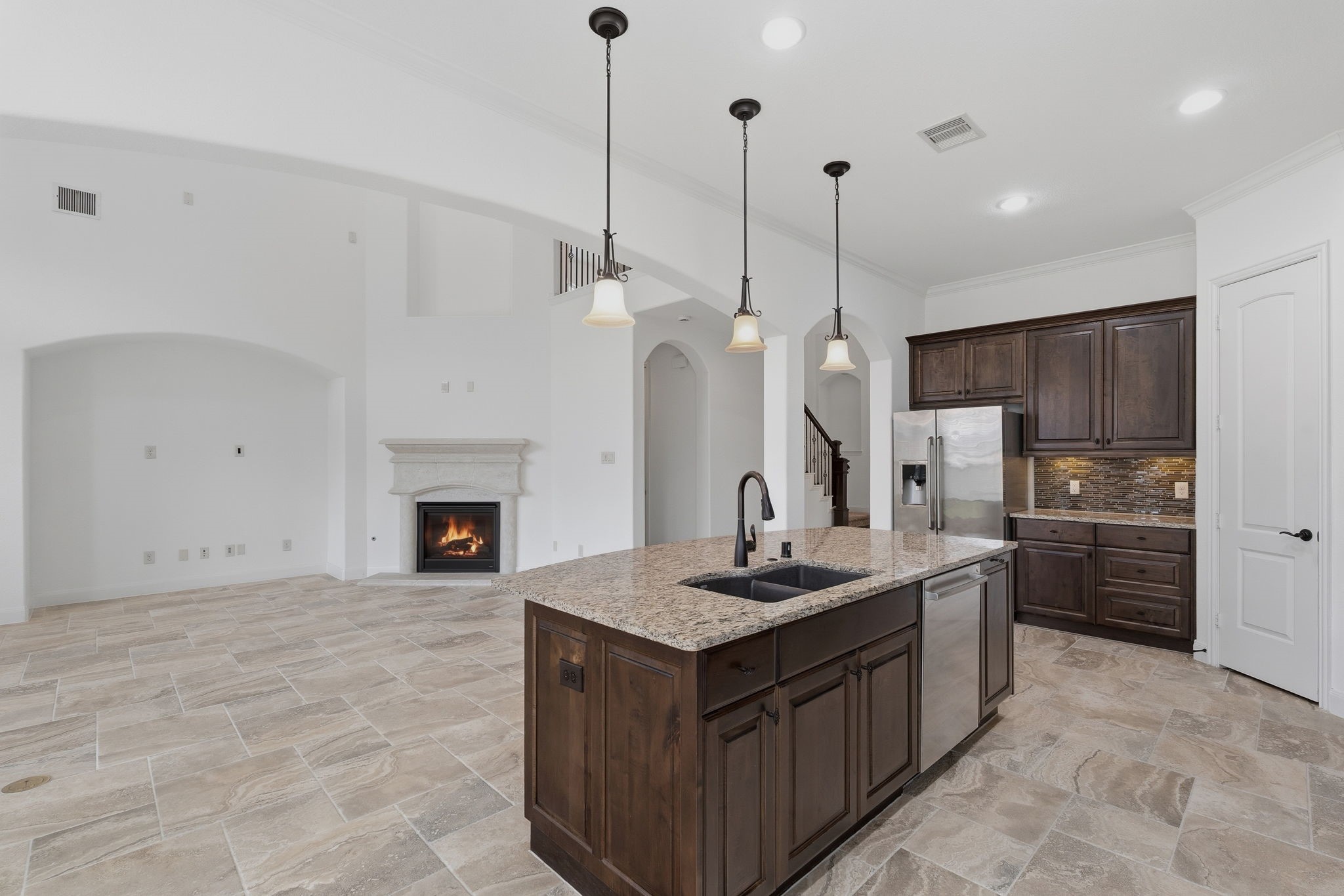 31407 Falling Cedar Court Spring, TX 77386 - Photo 8 of 47 And the chef will be included in all the activity in the family room! These tile floors are so easy to maintain.