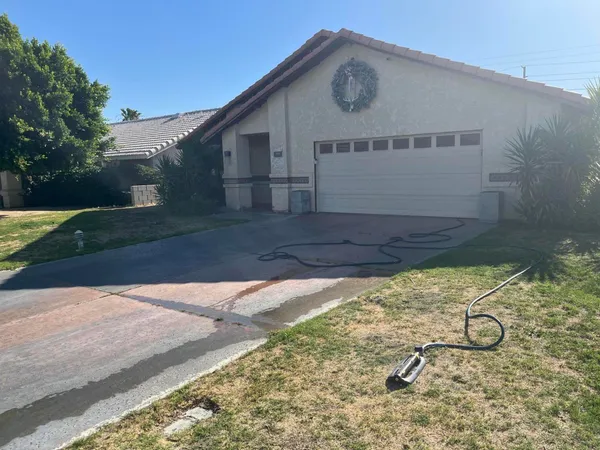a view of a house with a small yard