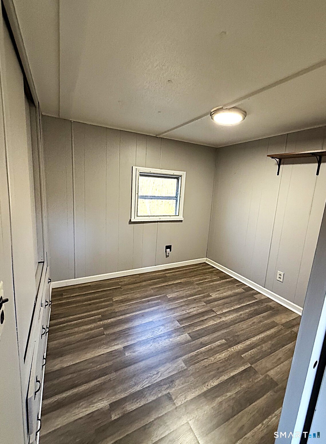 115 N Road Ashford, CT 06278 - Photo 11 of 19 a view of empty room with window and wooden floor