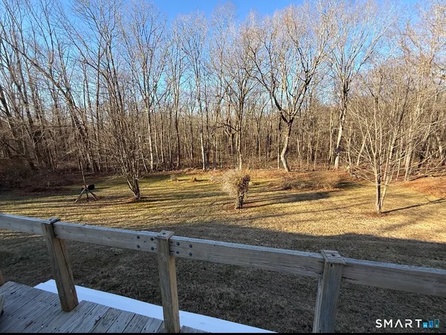 a view of a backyard of the house