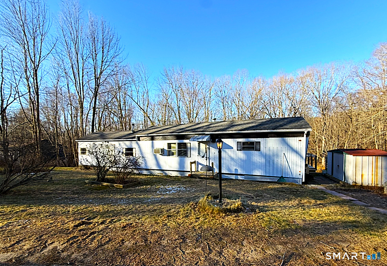 115 N Road Ashford, CT 06278 - Photo 2 of 19 a view of a yard with large trees