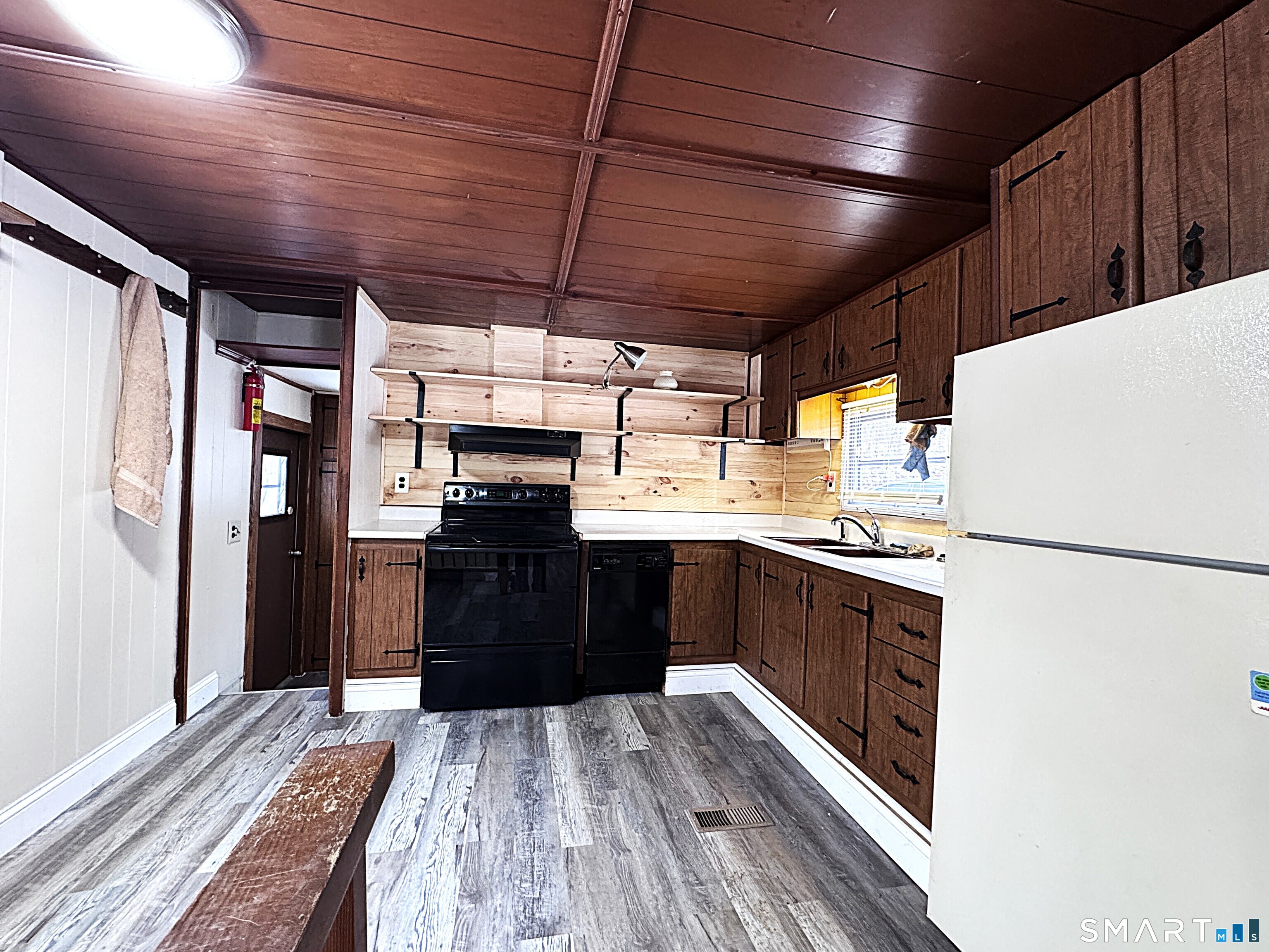 115 N Road Ashford, CT 06278 - Photo 3 of 19 a kitchen with a refrigerator and a stove top oven