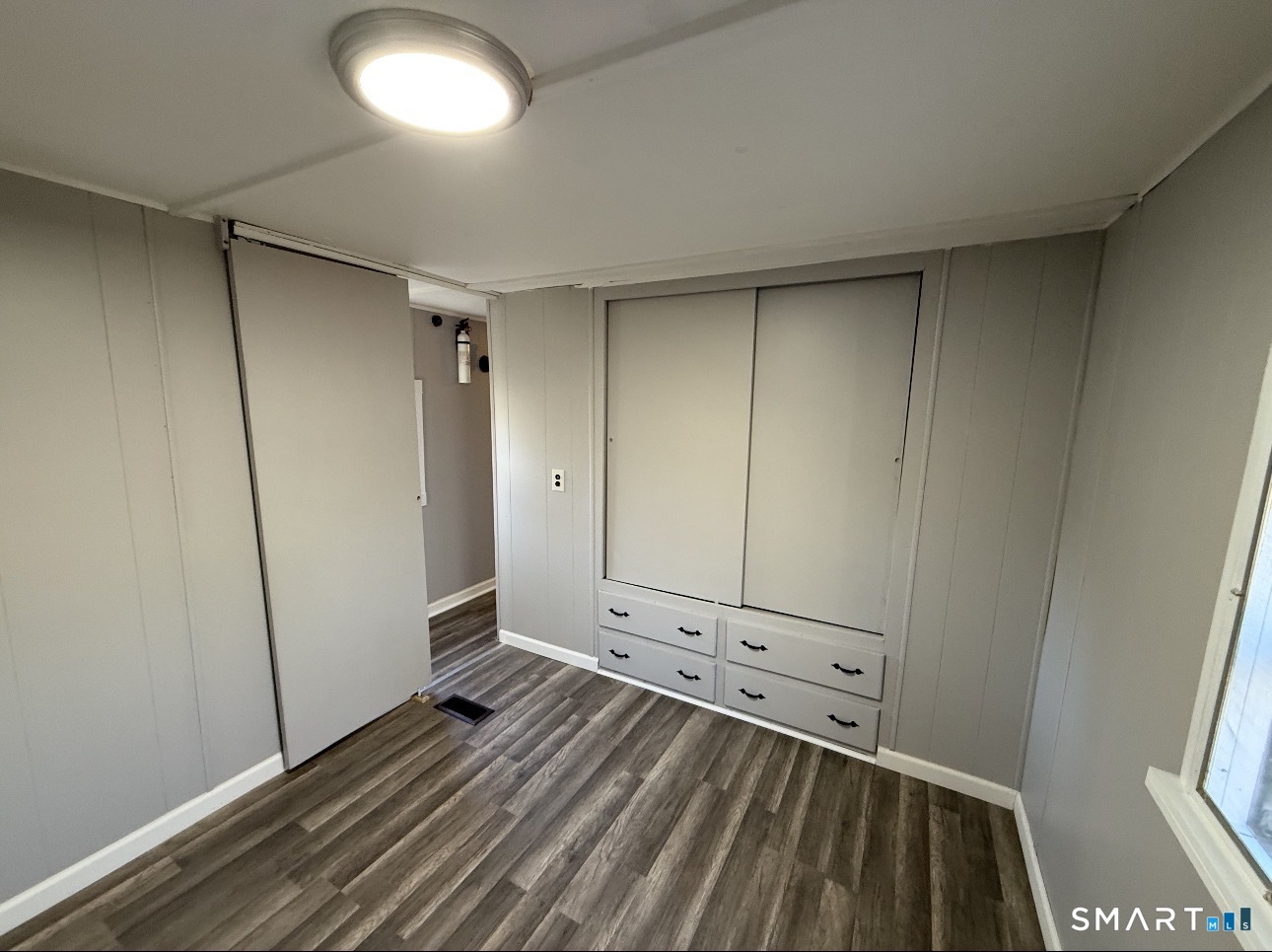 115 N Road Ashford, CT 06278 - Photo 8 of 19 a view of a room with wooden floor and white walls