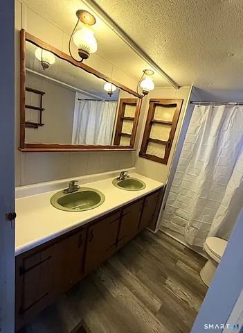 a bathroom with a sink and mirror
