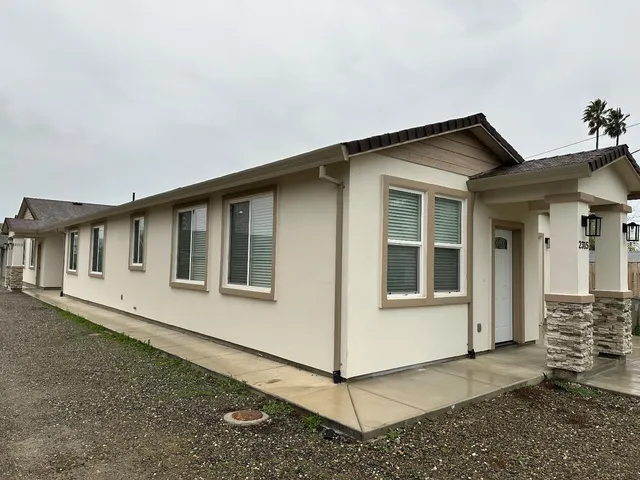 a front view of a house with yard
