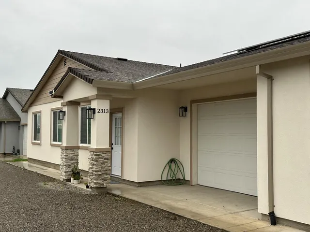 an entrance to house with yard