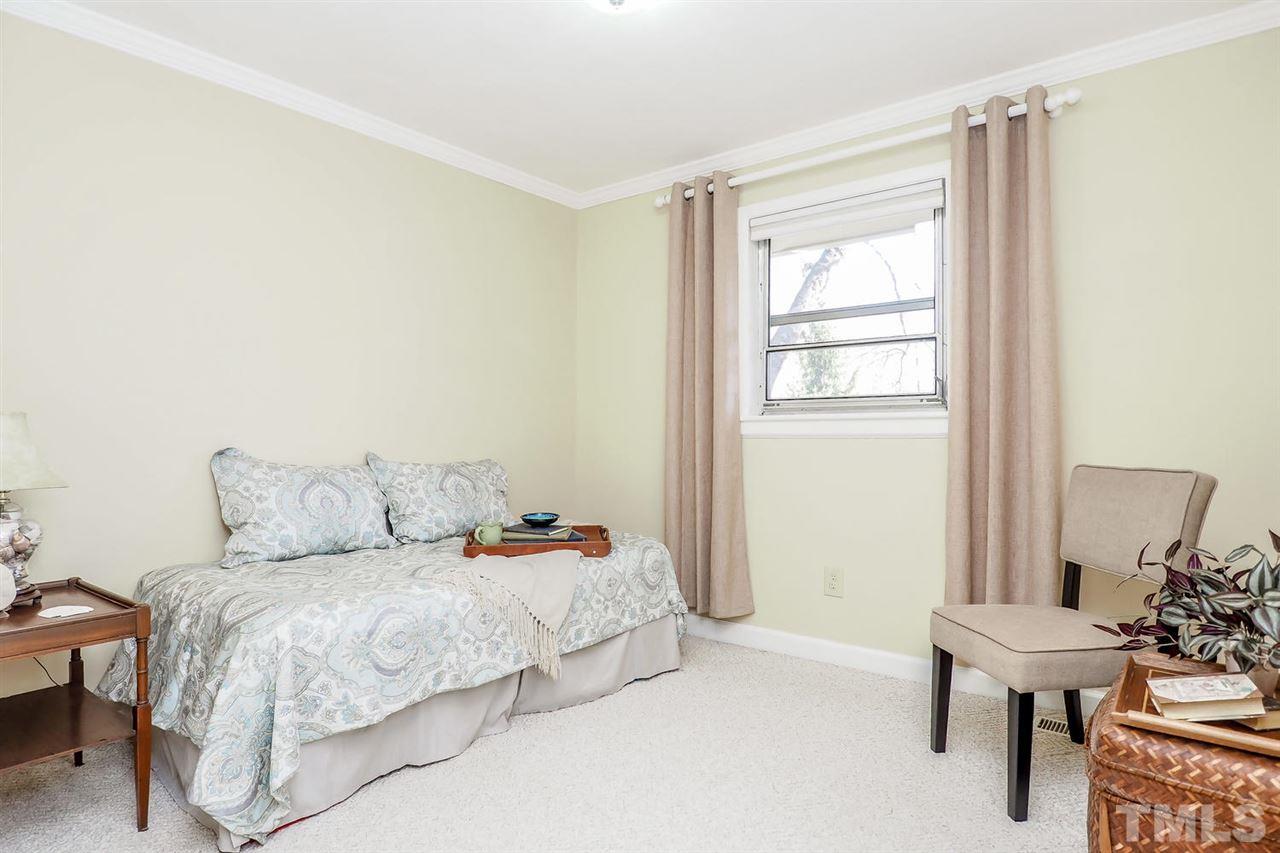 12345 Creedmoor Road Raleigh, NC 27613 - Photo 15 of 25 a bedroom with a bed and a window