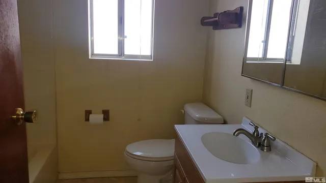 a bathroom with a sink and a toilet