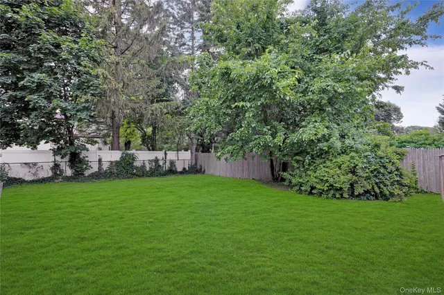 a view of a chairs and table in patio