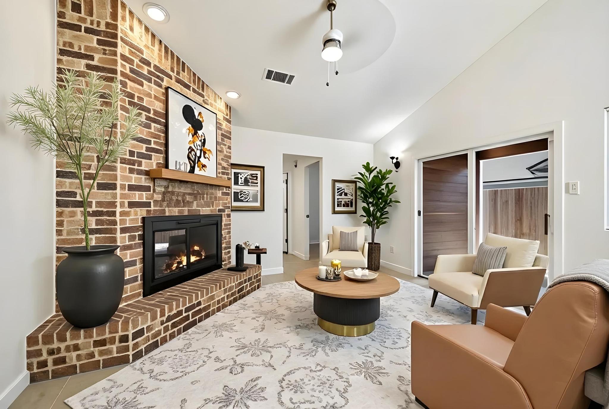 2614 Howellwood Way, Unit B Austin, TX 78748 - Photo 1 of 24 a living room with furniture a fireplace and a potted plant