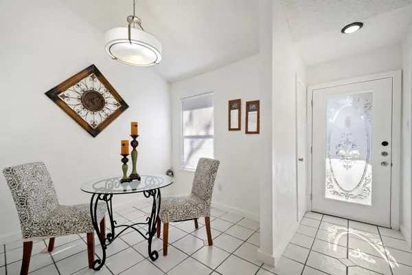 a view of a livingroom with furniture and a table