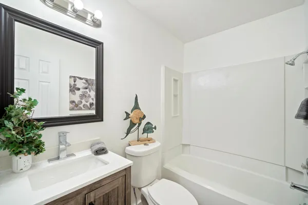 a room with a white cabinets and sink