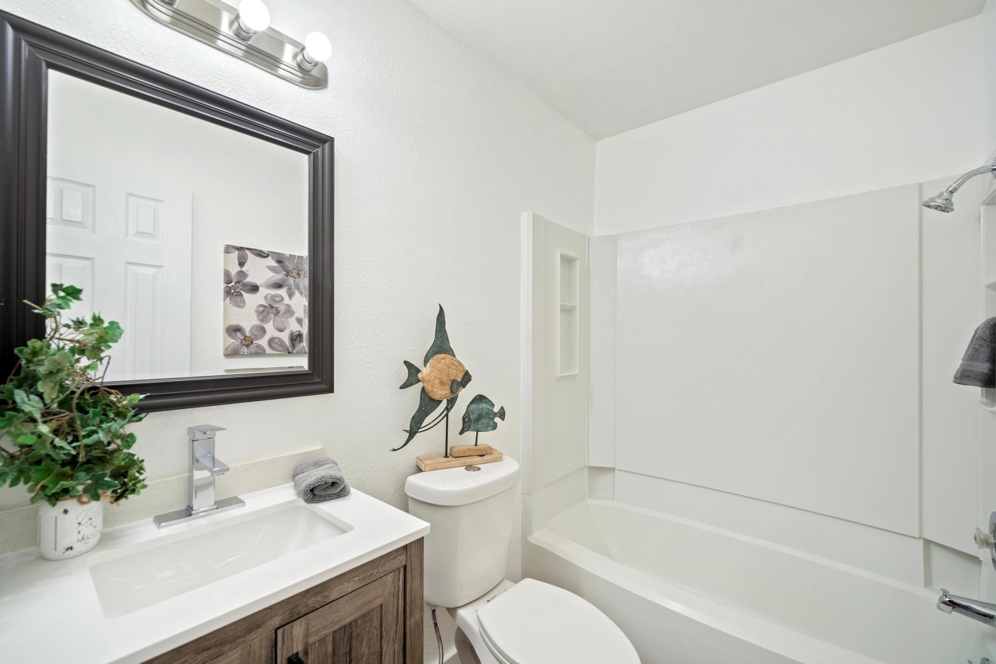 2614 Howellwood Way, Unit B Austin, TX 78748 - Photo 20 of 24 a bathroom with a sink toilet and shower